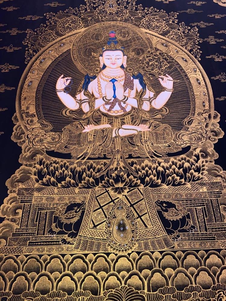 Four-armed Chenrezig painted in gold line on deep blue.